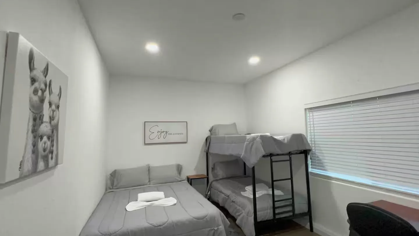 Bedroom with bunk beds and alpaca artwork at The Alpacas vacation rental in Tracy CA